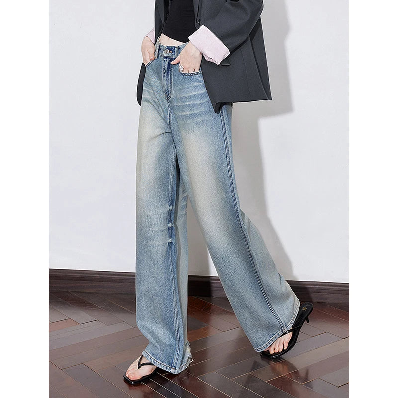 Jean femme taille mi‑haute coupe droite large longueur longue