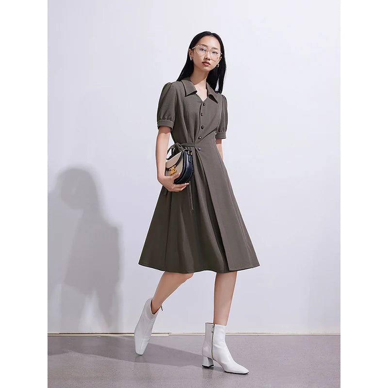 Women's dress with lace-up belt, shirt collar, and puff sleeves, navy blue